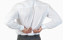 Portrait of the painful back of a young businessman